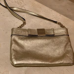 Gold leather crossbody with Kate Spade Emblem